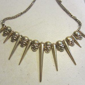 Gold tone skull necklace